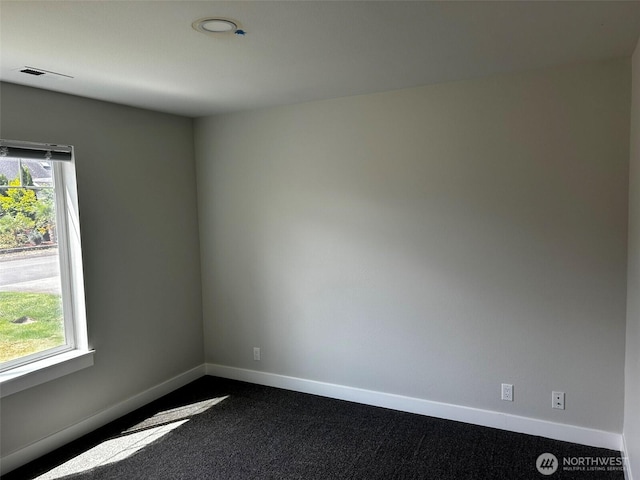2011 85th Street Ct E, Tacoma, WA 98445 - spare room featuring baseboards and dark colored carpet