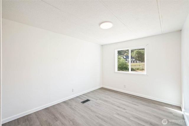 138 Trestle View Ln, Dryden, WA 98821 - unfurnished room featuring wood finished floors and a textured ceiling