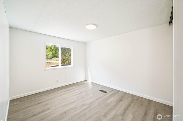 138 Trestle View Ln, Dryden, WA 98821 - spare room with wood finished floors and baseboards