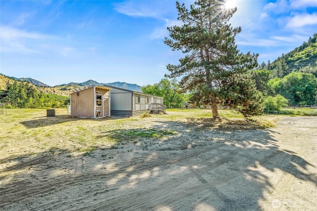 138 Trestle View Ln, Dryden, WA 98821 - view of yard with a mountain view and an outdoor structure