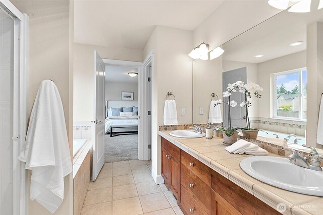 9225 225th Ave E, Buckley, WA 98321 - ensuite bathroom with double vanity, a garden tub, and tile patterned flooring