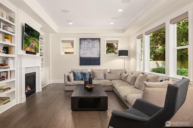 11050 SE 30th St, Bellevue, WA 98004 - living area with plenty of natural light, dark wood finished floors, a glass covered fireplace, crown molding, and built in features