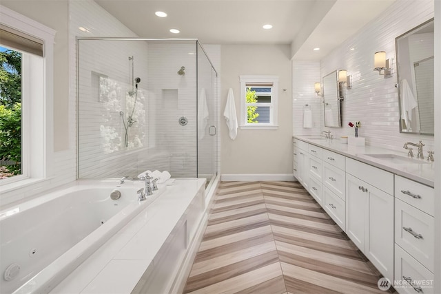 11050 SE 30th St, Bellevue, WA 98004 - bathroom featuring double vanity, a jetted tub, a stall shower, and recessed lighting