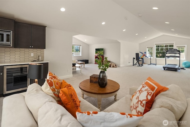 11050 SE 30th St, Bellevue, WA 98004 - living room featuring vaulted ceiling, wine cooler, light carpet, recessed lighting, and wet bar