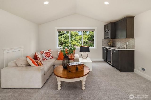 11050 SE 30th St, Bellevue, WA 98004 - living area featuring lofted ceiling, light carpet, recessed lighting, and wine cooler