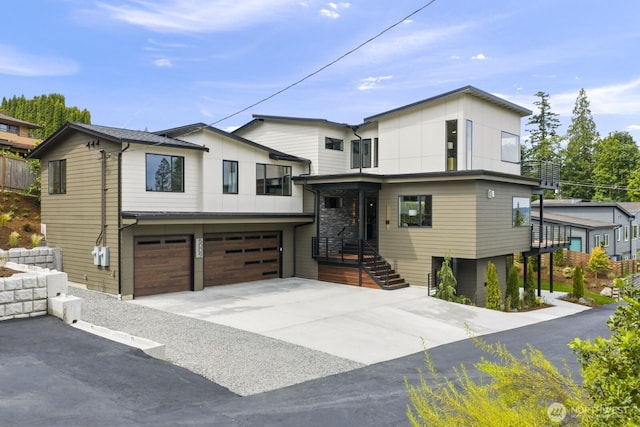 5009 Ocean Ave, Everett, WA 98203 - contemporary house with a garage, driveway, and board and batten siding