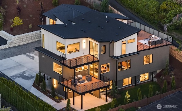 5009 Ocean Ave, Everett, WA 98203 - back of house featuring a balcony, a patio, outdoor lounge area, and stucco siding