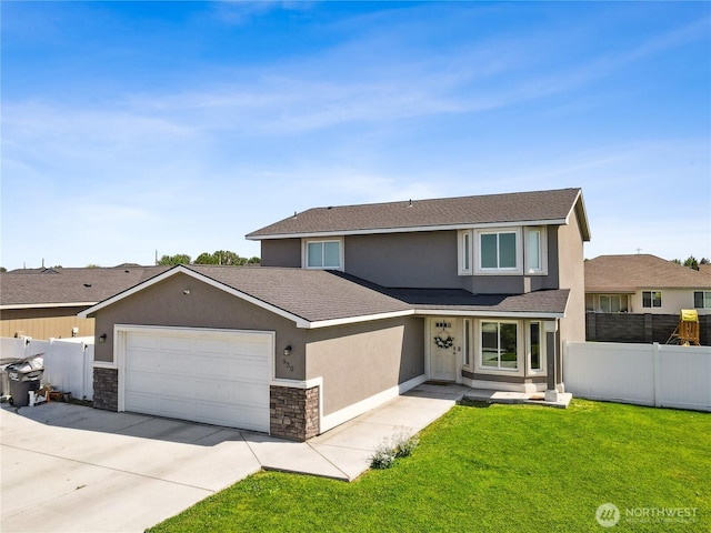 920 E Mt Adams St, Othello, WA 99344 - view of front of home with stucco siding, a garage, driveway, stone siding, and a shingled roof