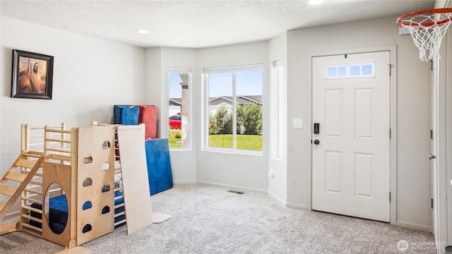 920 E Mt Adams St, Othello, WA 99344 - foyer entrance featuring carpet flooring, healthy amount of natural light, and recessed lighting