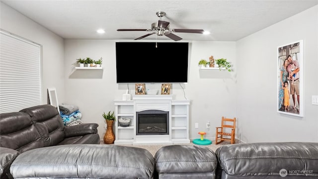 920 E Mt Adams St, Othello, WA 99344 - living area featuring a ceiling fan, a glass covered fireplace, and recessed lighting