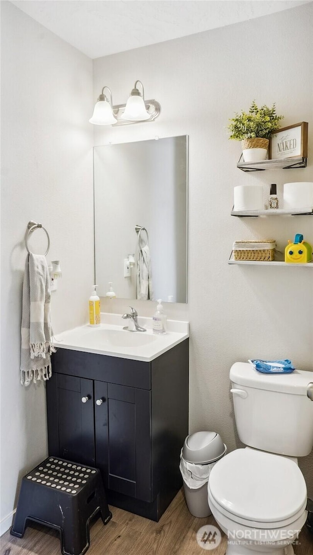 920 E Mt Adams St, Othello, WA 99344 - bathroom with wood finished floors and vanity