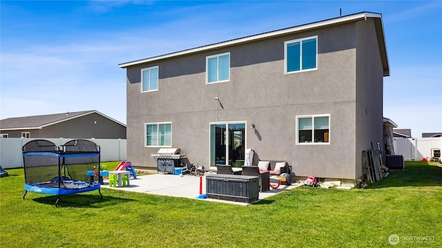 920 E Mt Adams St, Othello, WA 99344 - rear view of property featuring stucco siding, an outdoor living space, and a patio area