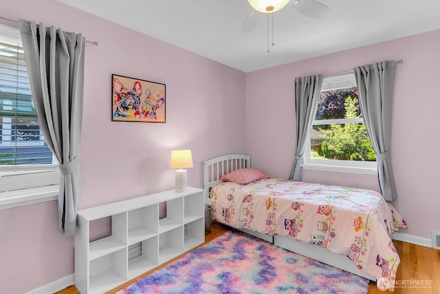 11729 Phinney Ave N, Seattle, WA 98133 - bedroom with wood finished floors and a ceiling fan