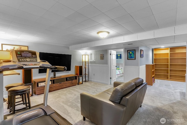 11729 Phinney Ave N, Seattle, WA 98133 - carpeted living area featuring wainscoting and built in shelves