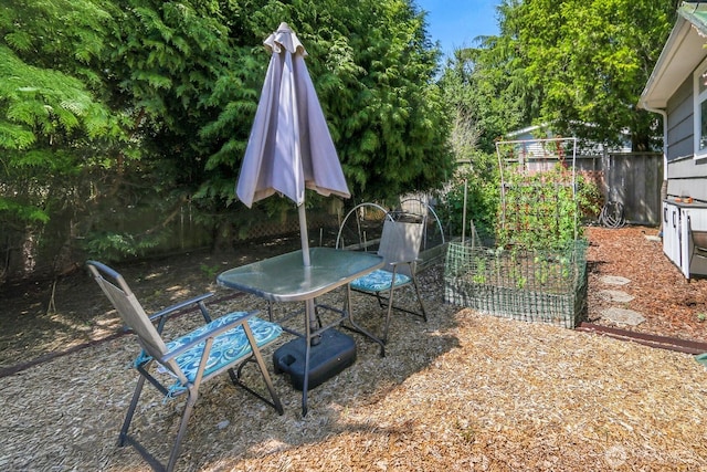 11729 Phinney Ave N, Seattle, WA 98133 - view of patio / terrace featuring a vegetable garden