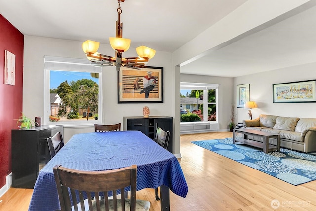 11729 Phinney Ave N, Seattle, WA 98133 - dining space featuring a chandelier and wood finished floors