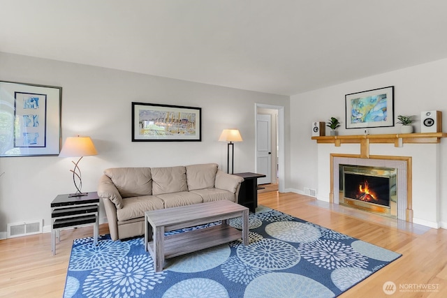 11729 Phinney Ave N, Seattle, WA 98133 - living area with wood finished floors and a tile fireplace