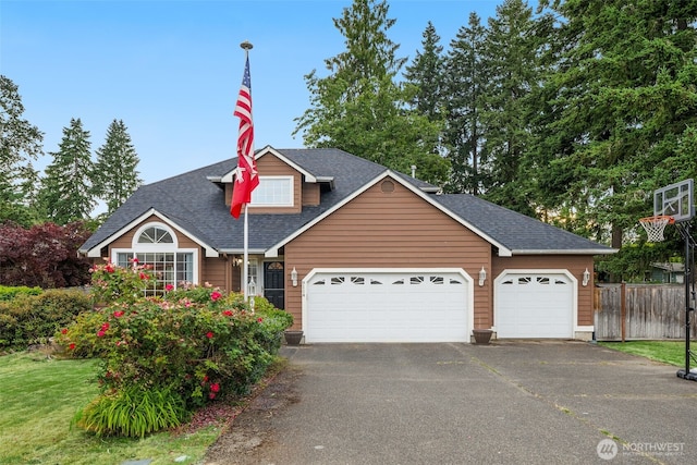 9114 80th Ave SW, Lakewood, WA 98498 - traditional-style home featuring asphalt driveway, a shingled roof, and a garage