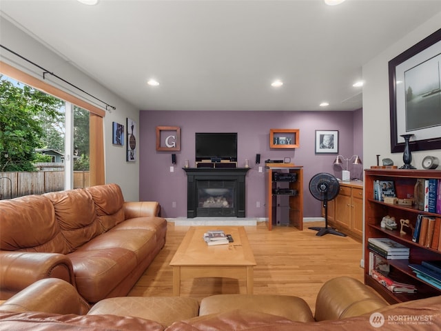 9114 80th Ave SW, Lakewood, WA 98498 - living area featuring light wood-style flooring, a glass covered fireplace, and recessed lighting