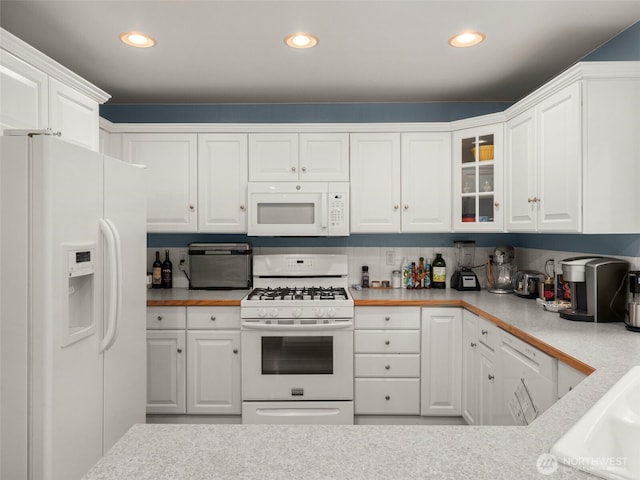 9114 80th Ave SW, Lakewood, WA 98498 - kitchen with white appliances, white cabinets, light countertops, glass insert cabinets, and recessed lighting
