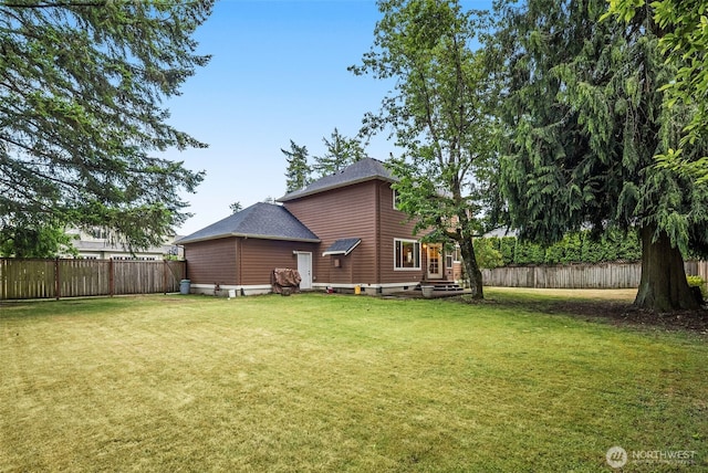 9114 80th Ave SW, Lakewood, WA 98498 - rear view of house with a fenced backyard and roof with shingles