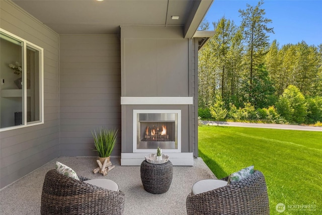 11306 143rd Dr NE, Lake Stevens, WA 98258 - view of patio / terrace featuring a warm lit fireplace