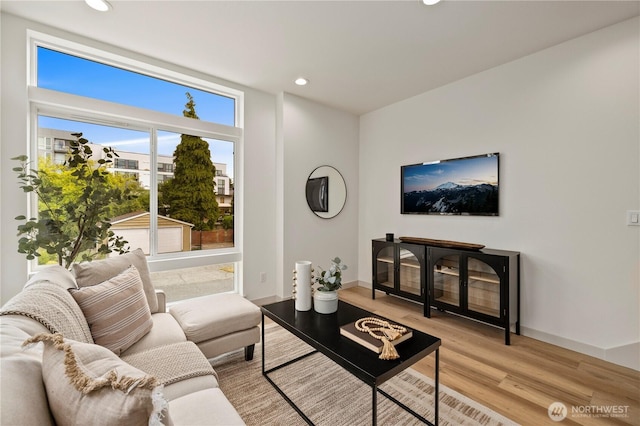 7013 9th Ave NE, Seattle, WA 98115 - living area with light wood finished floors and recessed lighting