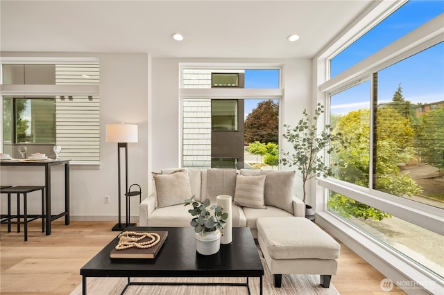 7013 9th Ave NE, Seattle, WA 98115 - living room featuring healthy amount of natural light, wood finished floors, and recessed lighting