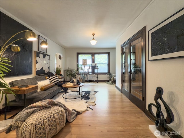 2328 10th Ave E Unit 102, Seattle, WA 98102 - living room with wood finished floors, crown molding, and arched walkways