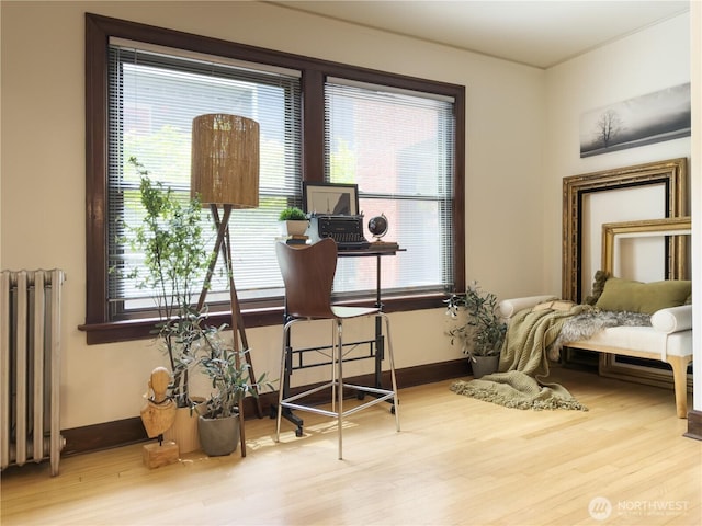 2328 10th Ave E Unit 102, Seattle, WA 98102 - office with radiator heating unit, healthy amount of natural light, and wood finished floors