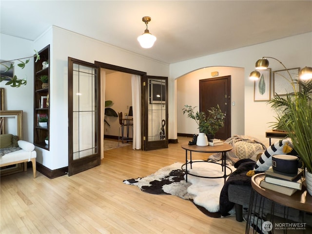2328 10th Ave E Unit 102, Seattle, WA 98102 - living room with light wood-style floors and arched walkways