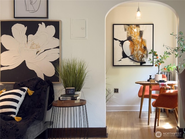 2328 10th Ave E Unit 102, Seattle, WA 98102 - living area featuring arched walkways and wood finished floors