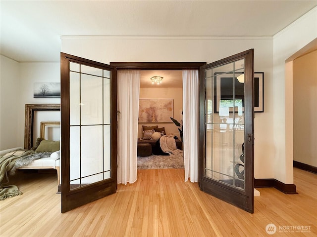 2328 10th Ave E Unit 102, Seattle, WA 98102 - corridor with light wood finished floors and crown molding