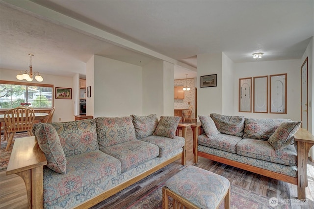 1754 NE Mesford Rd Unit 71, Poulsbo, WA 98370 - living area featuring a chandelier and wood finished floors