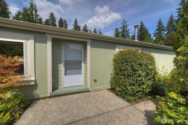 1754 NE Mesford Rd Unit 71, Poulsbo, WA 98370 - view of exterior entry featuring a patio