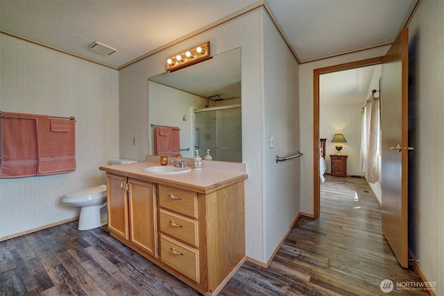 1754 NE Mesford Rd Unit 71, Poulsbo, WA 98370 - full bathroom with wood finished floors, vanity, a stall shower, and ornamental molding