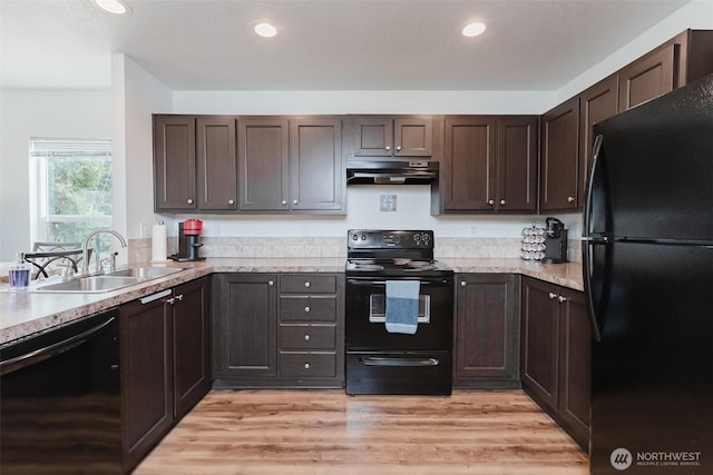 7543 Wooldridge Dr, Blaine, WA 98230 - kitchen featuring black appliances, under cabinet range hood, dark brown cabinets, recessed lighting, and light wood-type flooring