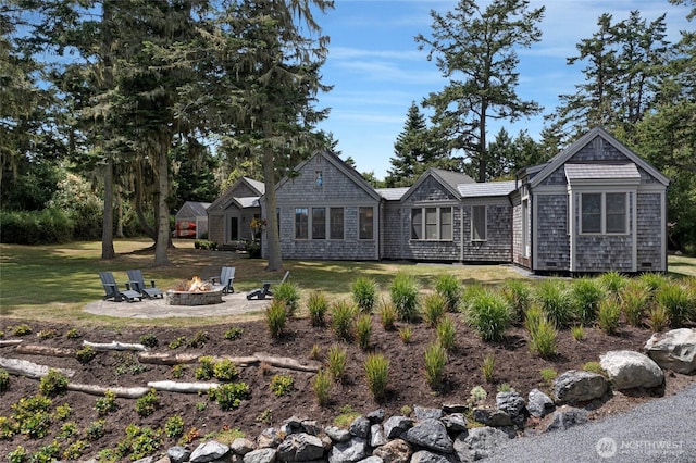 16 Bayshore Rd, Friday Harbor, WA 98250 - back of house with an outdoor fire pit, a lawn, and a patio area