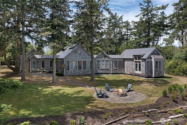 16 Bayshore Rd, Friday Harbor, WA 98250 - view of front of property with an outdoor fire pit, a front yard, and a patio