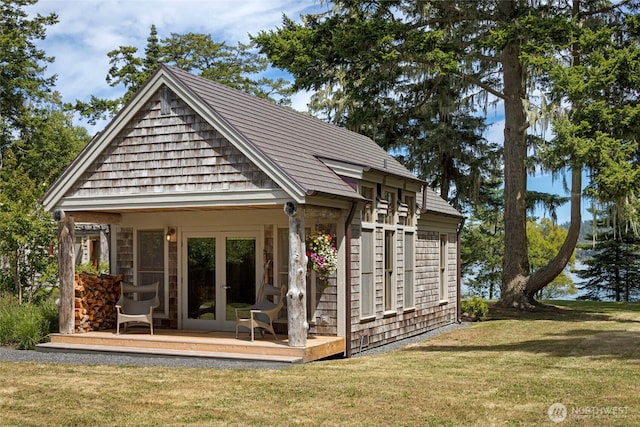 16 Bayshore Rd, Friday Harbor, WA 98250 - rear view of house with french doors, a lawn, and a deck