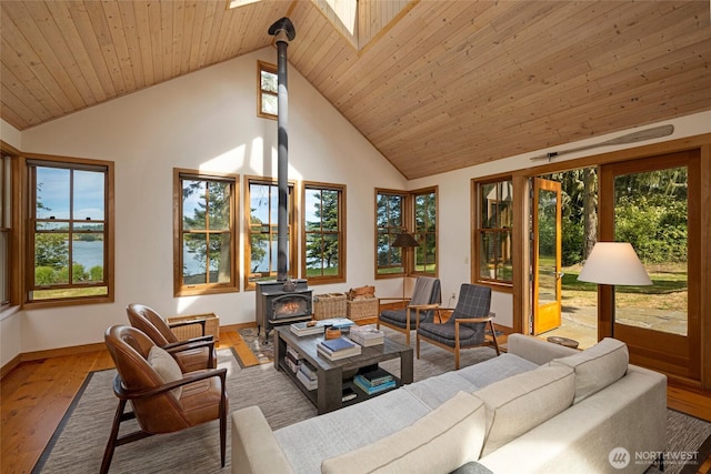 16 Bayshore Rd, Friday Harbor, WA 98250 - sunroom / solarium with a wood stove, lofted ceiling, and plenty of natural light