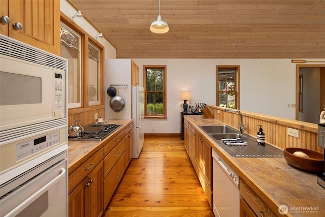16 Bayshore Rd, Friday Harbor, WA 98250 - kitchen with white appliances, butcher block countertops, light wood-type flooring, wood ceiling, and brown cabinets