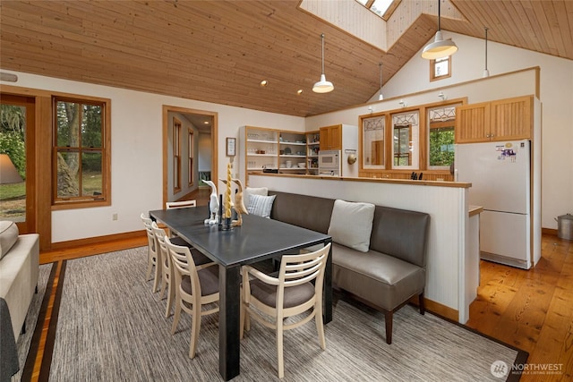 16 Bayshore Rd, Friday Harbor, WA 98250 - dining space featuring a skylight, light wood-style flooring, wooden ceiling, and high vaulted ceiling