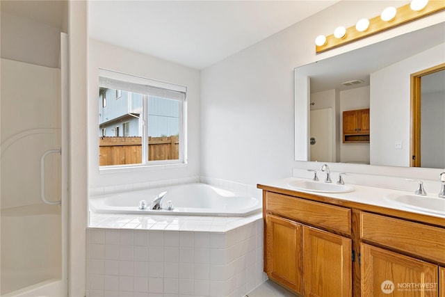 8803 136th St E, Puyallup, WA 98373 - bathroom with a bath, double vanity, and a shower