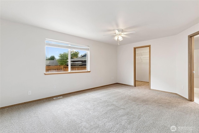 8803 136th St E, Puyallup, WA 98373 - spare room with ceiling fan and light colored carpet
