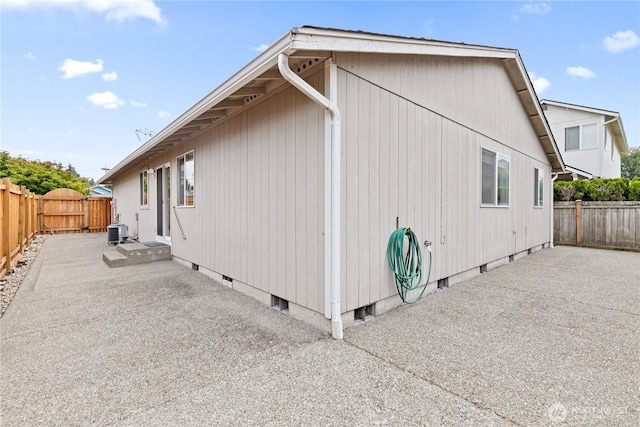 8803 136th St E, Puyallup, WA 98373 - view of property exterior with a patio area, a fenced backyard, and crawl space