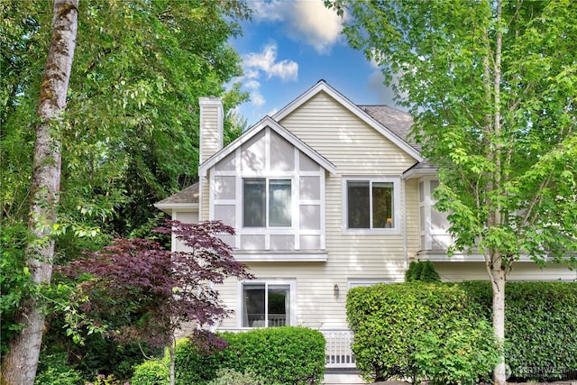 6707 SE Cougar Mountain Way Unit 2, Bellevue, WA 98006 - view of front of property with a chimney and roof with shingles