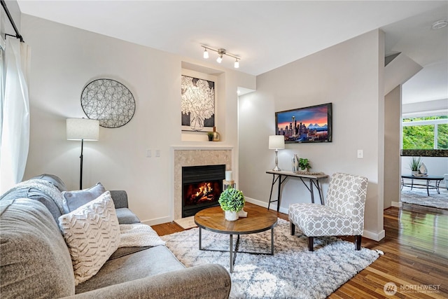 6707 SE Cougar Mountain Way Unit 2, Bellevue, WA 98006 - living area featuring a high end fireplace and wood finished floors