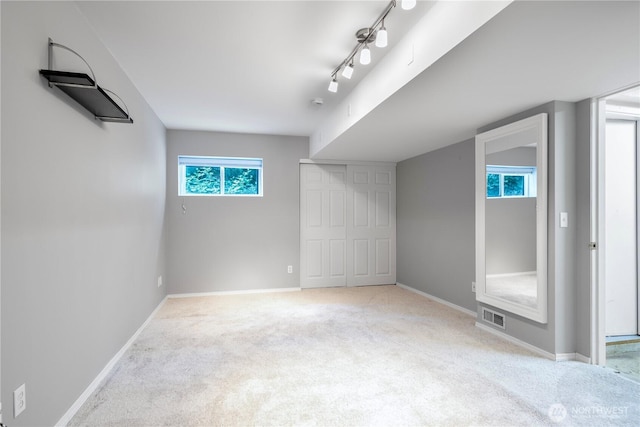 6707 SE Cougar Mountain Way Unit 2, Bellevue, WA 98006 - unfurnished bedroom with carpet and a closet
