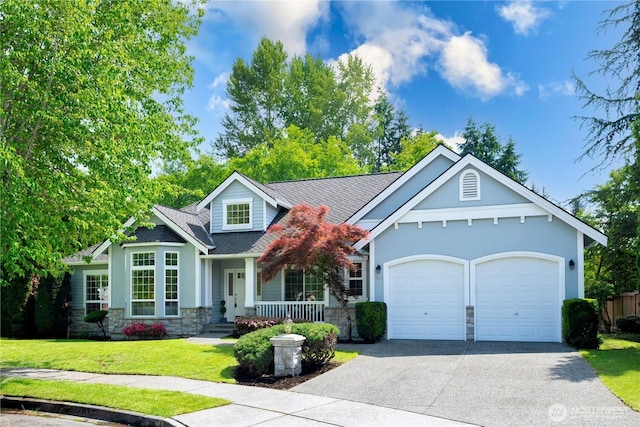 1912 243rd Pl SE, Bothell, WA 98021 - view of front of home featuring stone siding, a porch, driveway, a garage, and a front lawn